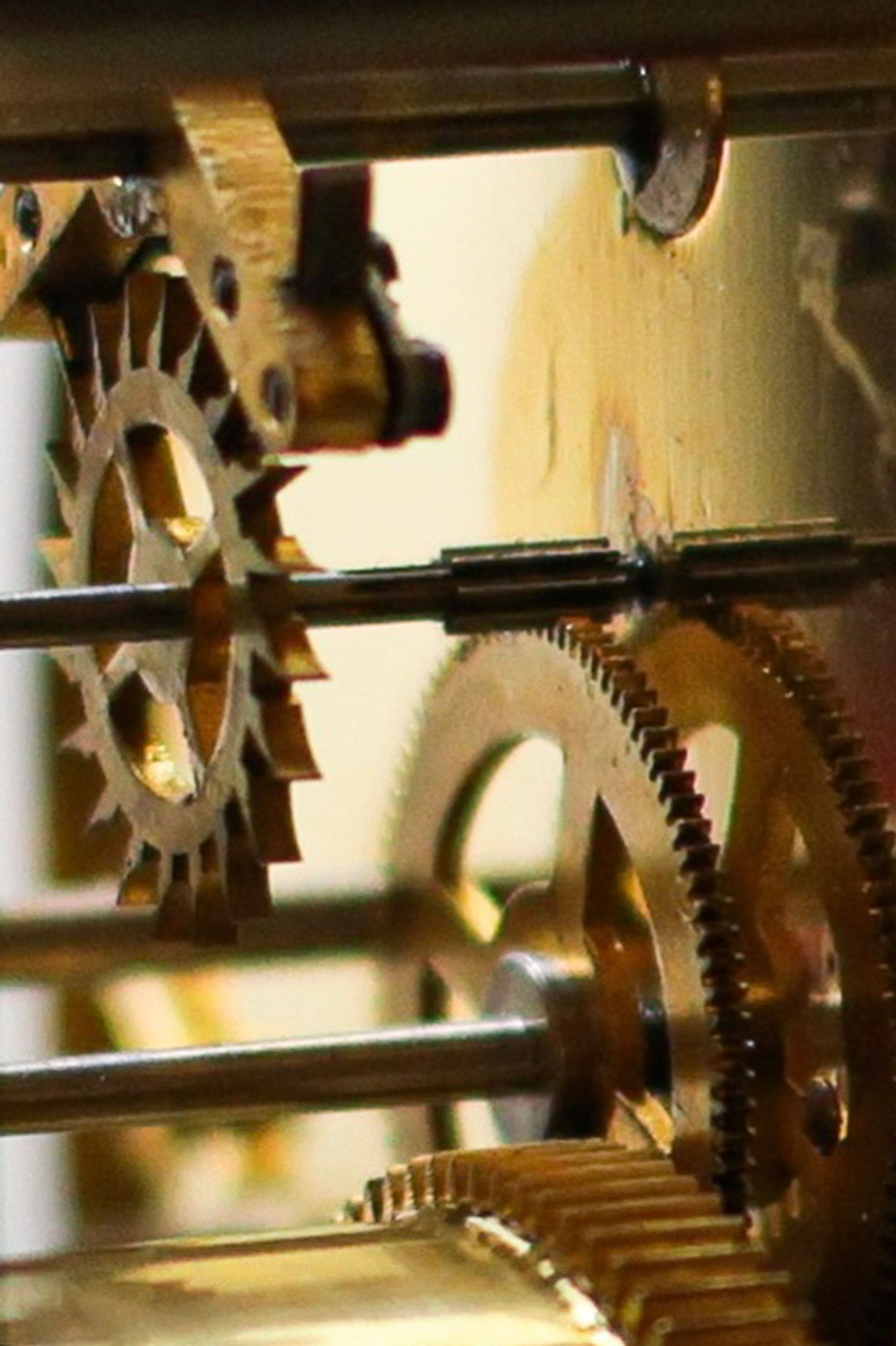 A close up of the anchor escapement of the Koma clock. The wheel with sharp pointed gears is the escape wheel, and the structure over the escape wheel is the anchor.