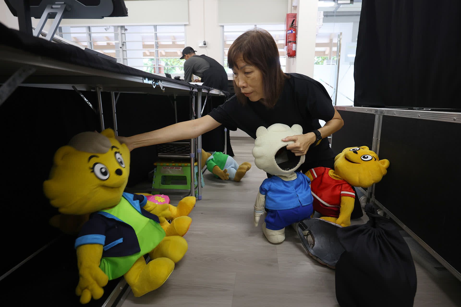 Ms Ho setting up for a performance at Little Olive Tree pre-school on June 19, 2024.