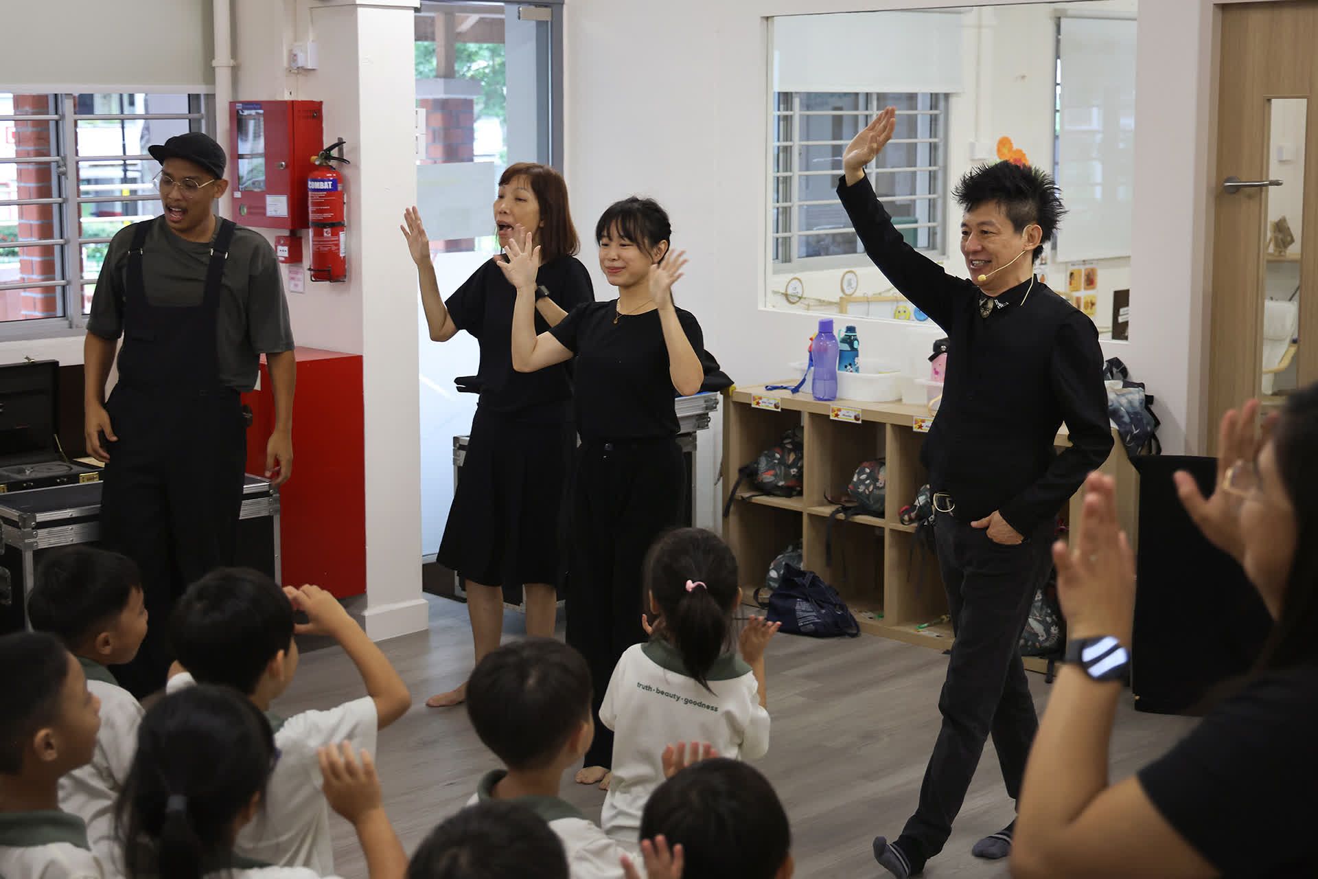 (From left) Mascots and Puppets Specialists staff Syaiful Hairi, 33, Jennifer Ho, 62, Ariel Chua, 26, and Mr Frankie Yeo waving at the end of their performance at Little Olive Tree pre-school.