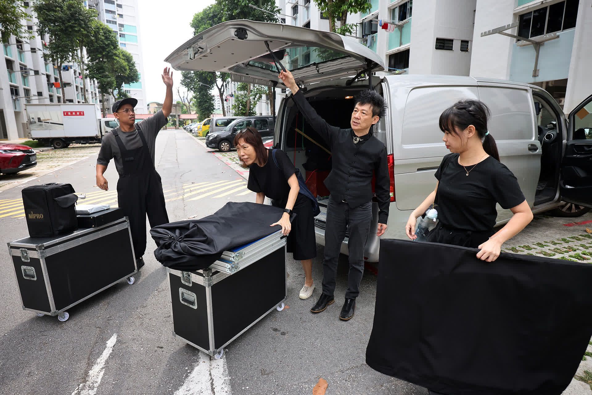 The team from Mascots and Puppets Specialists unloading equipment that they need for a show.
